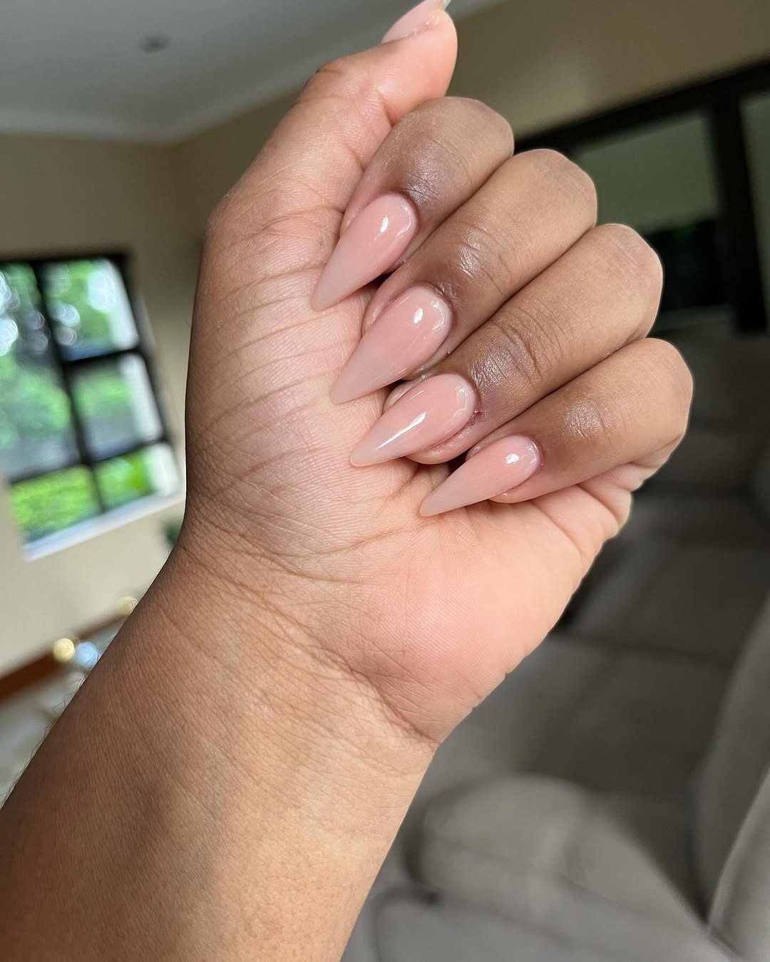 Natural pink manicure closeup